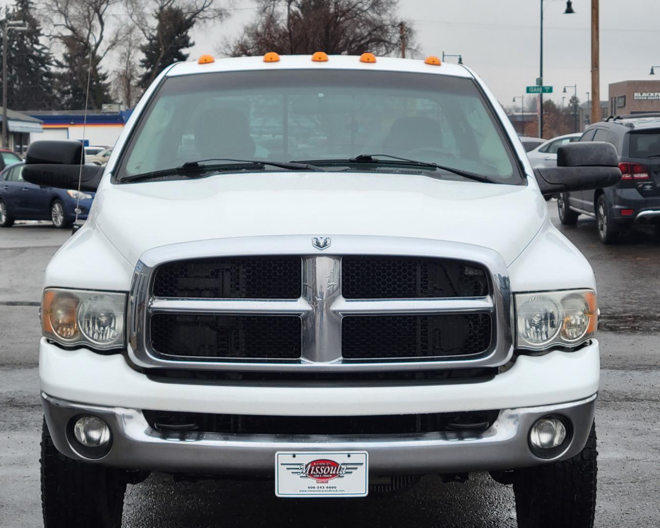 2005 White /Black Dodge Ram 3500 SLT (3D7LS38C85G) with an 5.9L I6 24V Cummins engine, 6 Speed Manual transmission, located at 450 N Russell, Missoula, MT, 59801, (406) 543-6600, 46.874496, -114.017433 - 4 Wheel Drive. One Ton Dually. Long Box. 6 Speed Manual Transmission. Has a lot of miles but runs amazingly. Air Cruise. Tilt. Power Windows and Locks. Power Drivers Seat. AM FM CD XM. 1 Owner. Clean Carfax. There is no financing options on this vehicle. - Photo#2